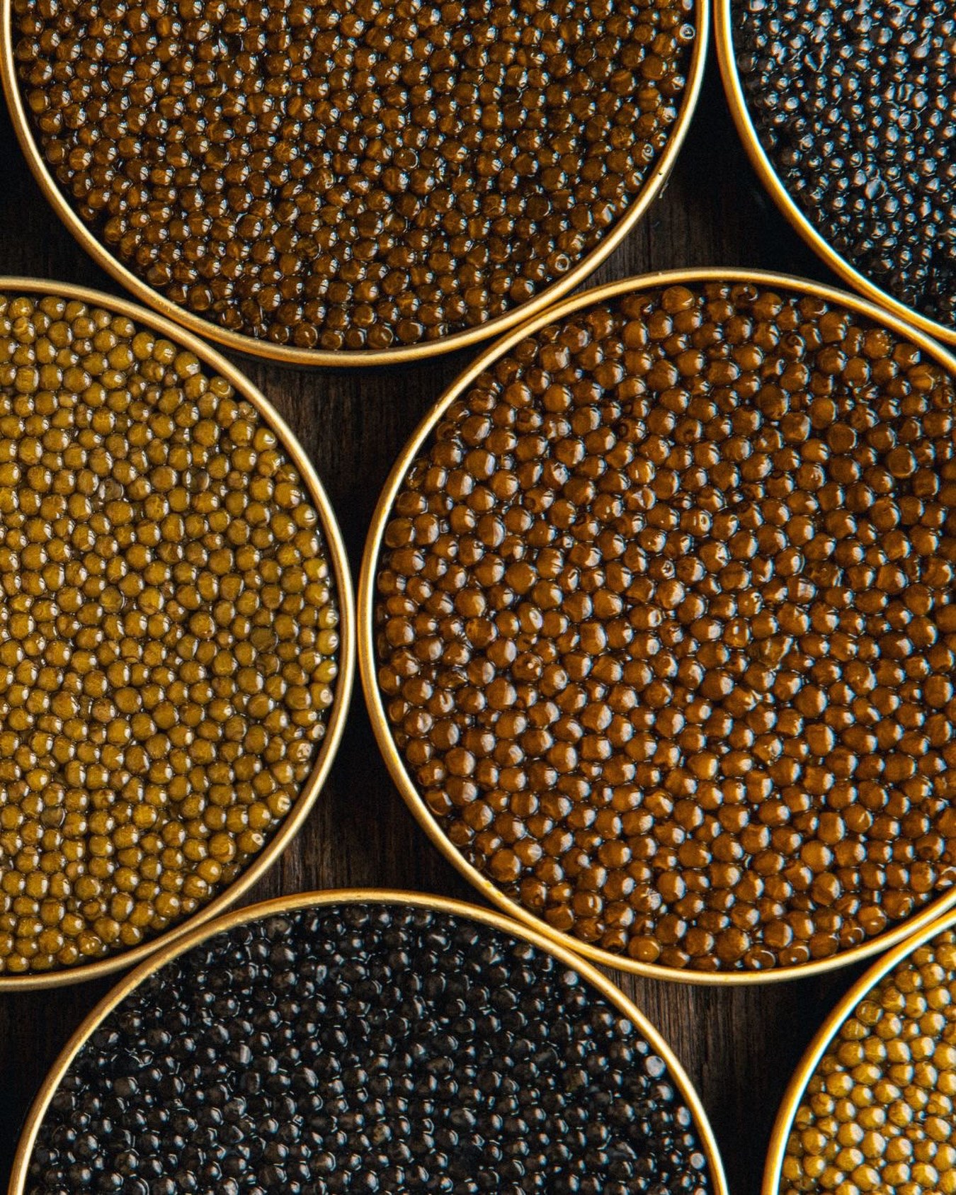 A selection of caviar varieties in round tins